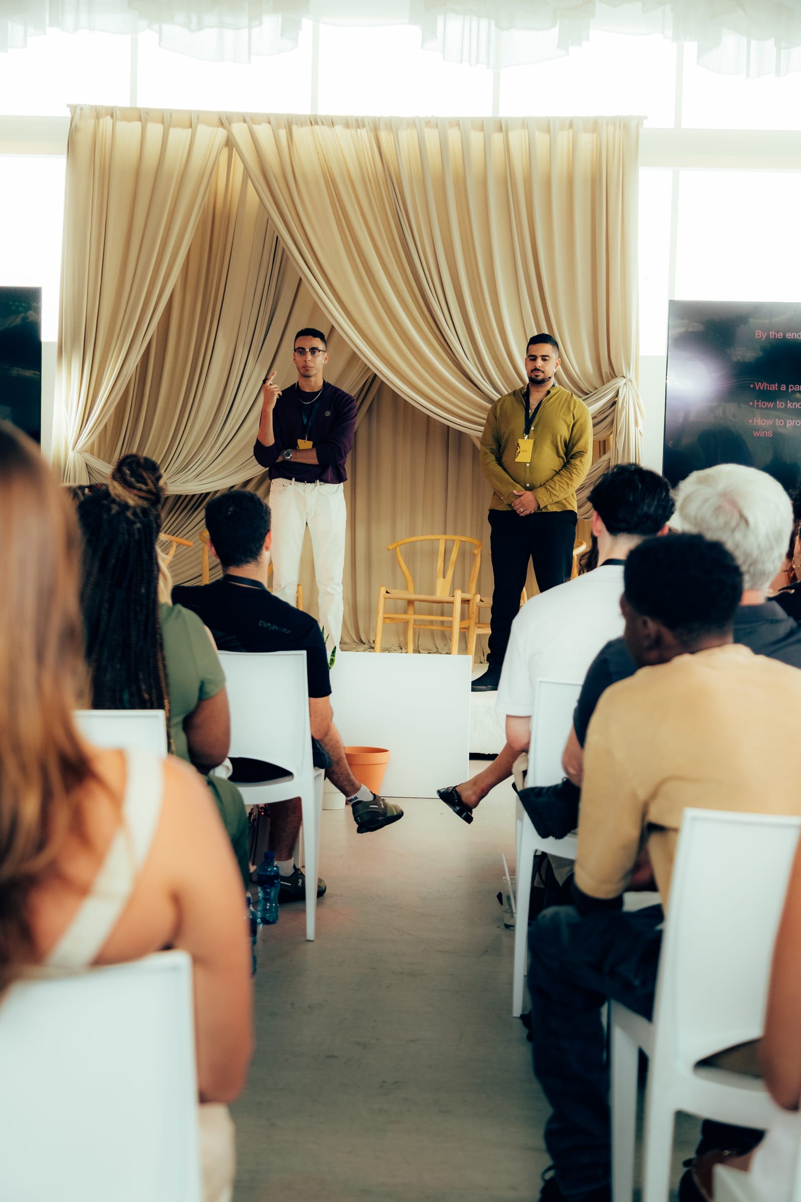 Speaker in conversation on the rooftop stage